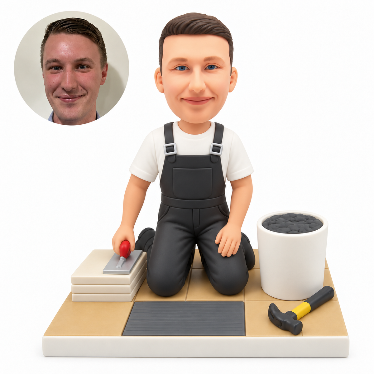 custom bobblehead figure male tiler in bib overalls kneeling on both knees beside a cement bucket and tiles