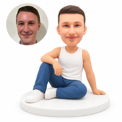custom bobblehead figure male in a tank top and jeans seated on the floor with one knee raised