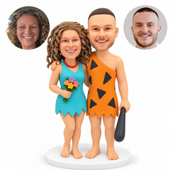 custom bobblehead figures prehistoric costume couple with the woman in a sleeveless ragged dress and the man in a one-shoulder tunic