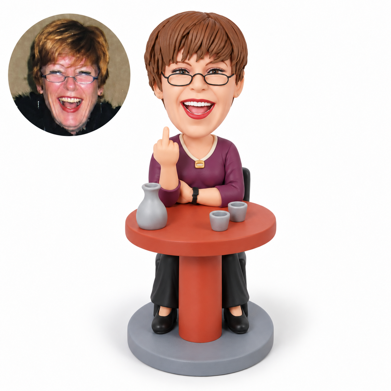 custom bobblehead figure woman seated at a round table making a middle-finger gesture beside a carafe and cups