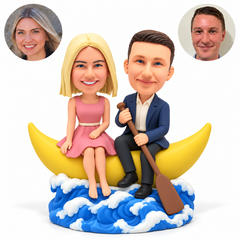 custom bobbleheads figures couple seated on a crescent moon boat with a paddle