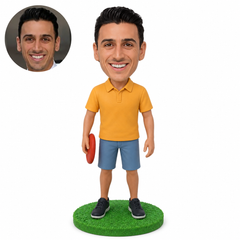 custom bobblehead figure disc golf player standing with a disc at his side