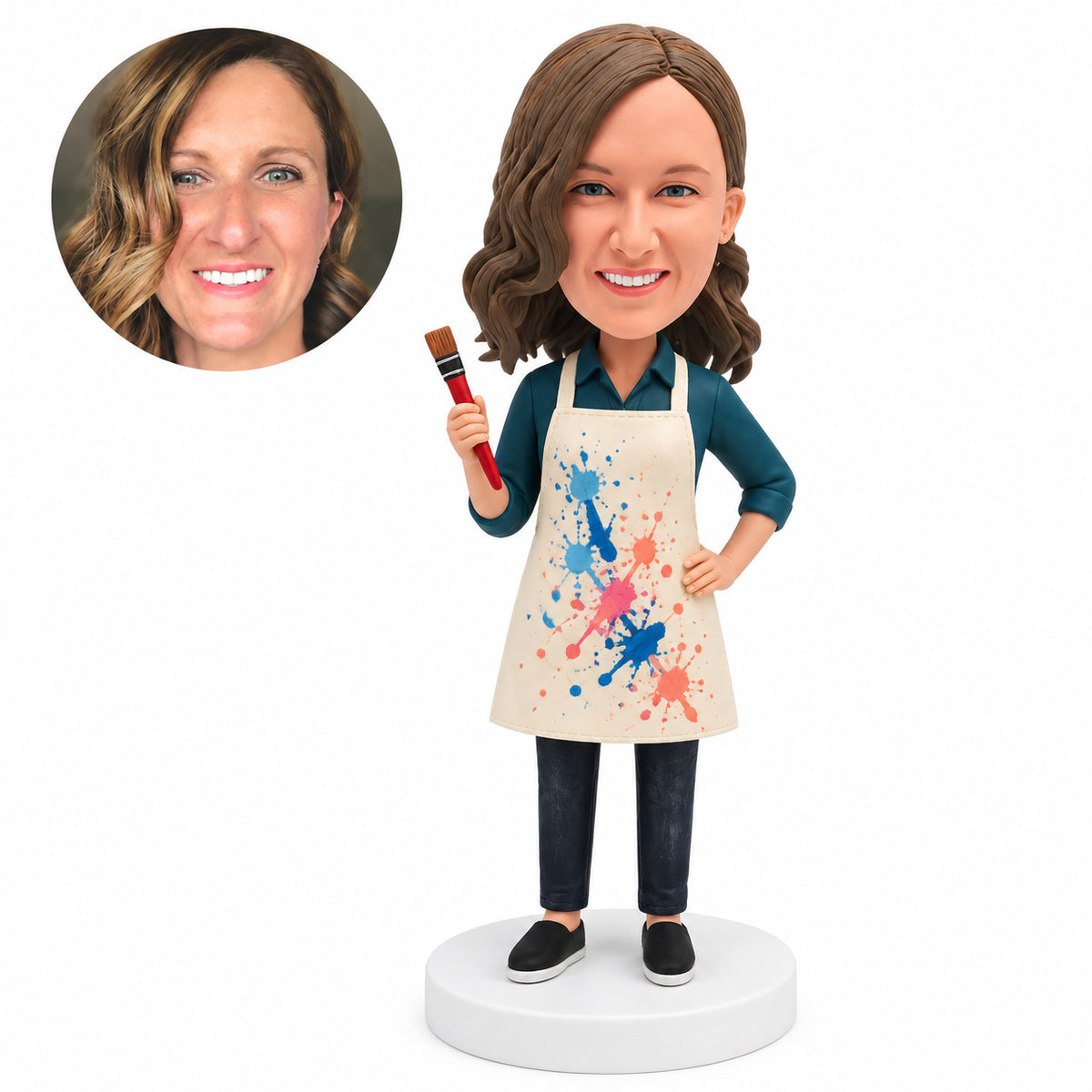 Custom female art teacher bobblehead in paint-splattered apron holding a brush