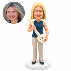 custom bobblehead figure female chiropractor in a sleeveless top holding a spine model diagonally