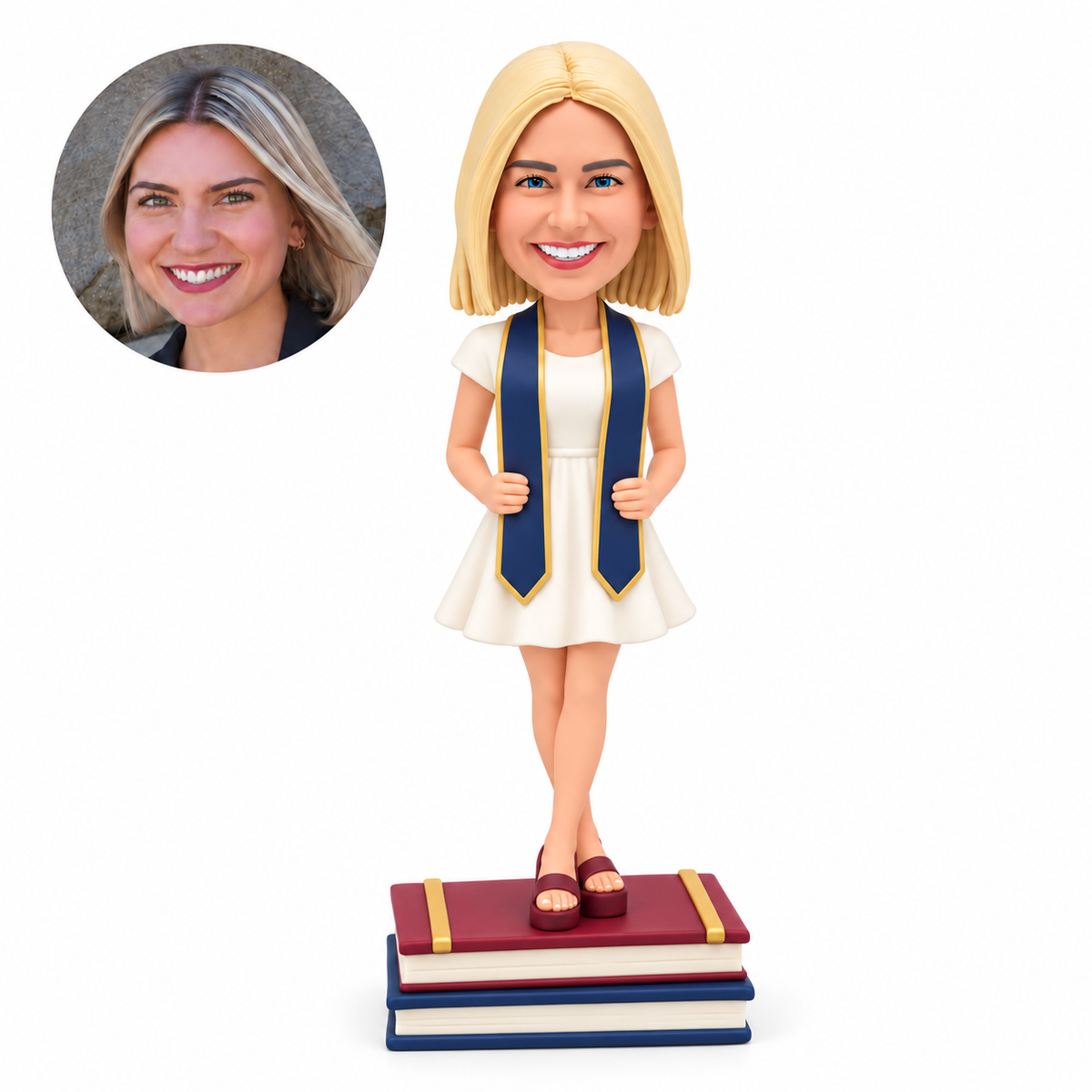 custom bobblehead figure female graduate in a short dress gripping her stole on stacked books