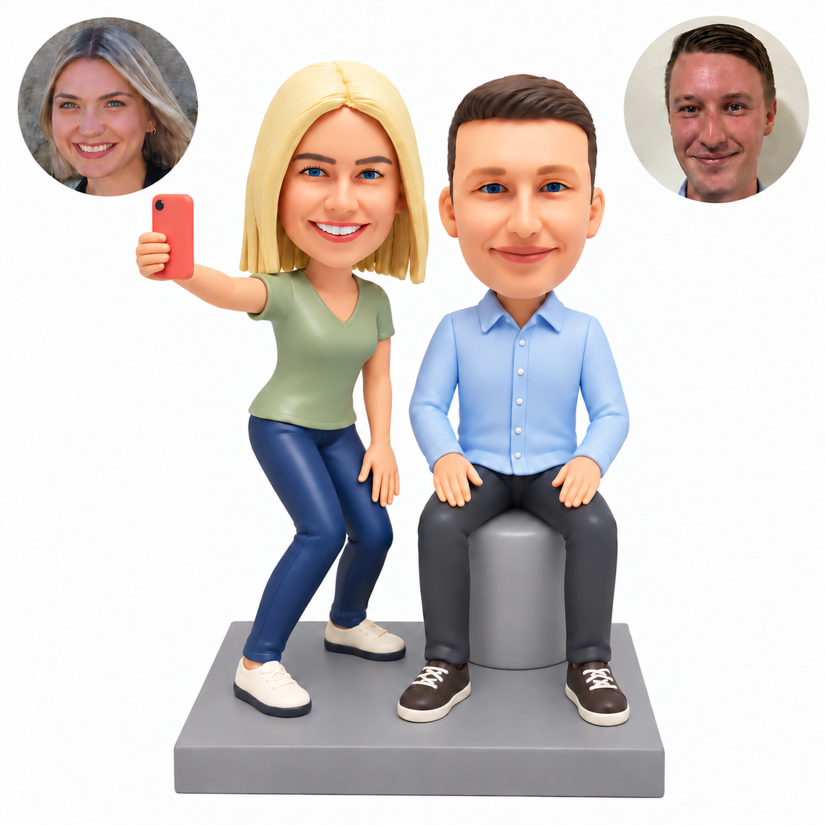 custom bobblehead figures selfie couple with a standing woman holding a phone beside a man seated on a stool