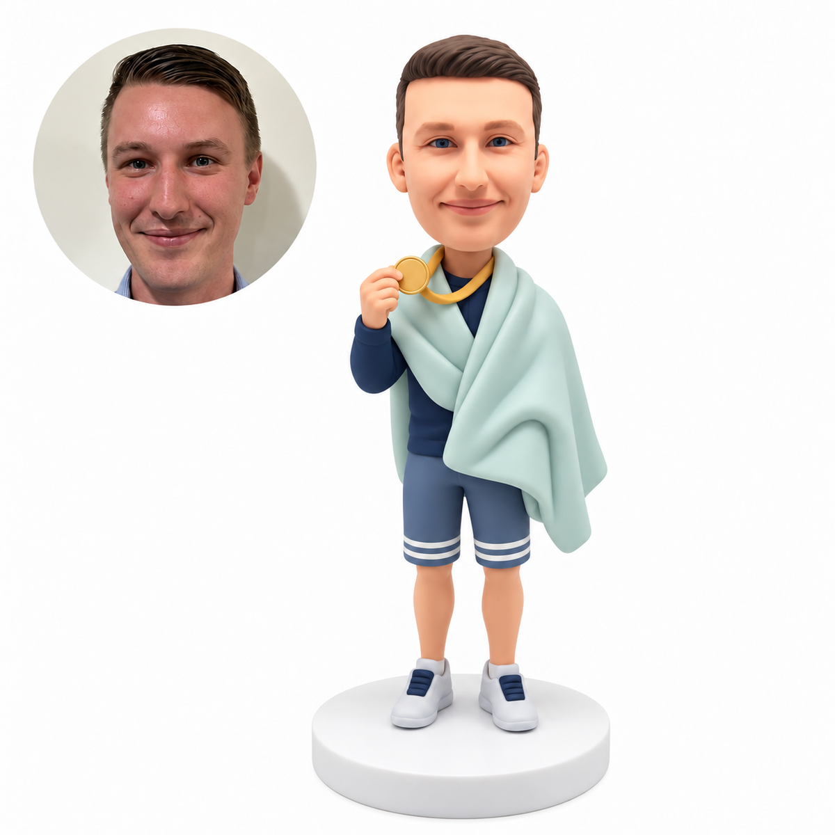 custom bobblehead figure male swimmer holding a medal with a towel draped over his shoulders