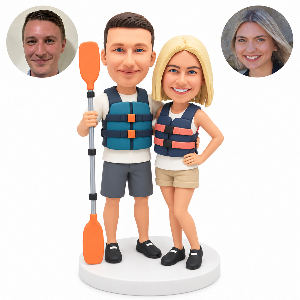 custom bobbleheads figures couple in life jackets with the man holding one upright kayak paddle