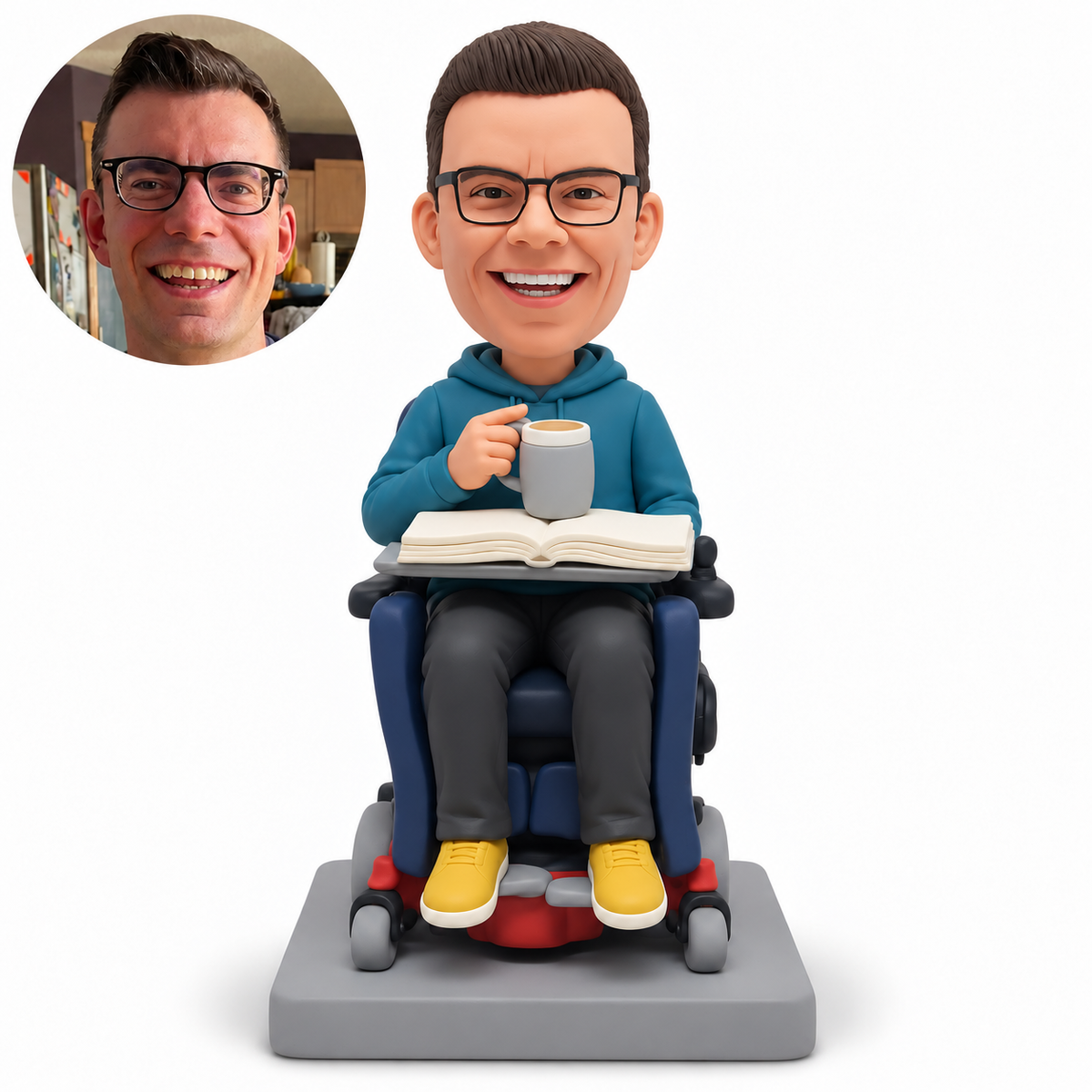 custom bobblehead figure man seated in a powered wheelchair with an open book and a mug