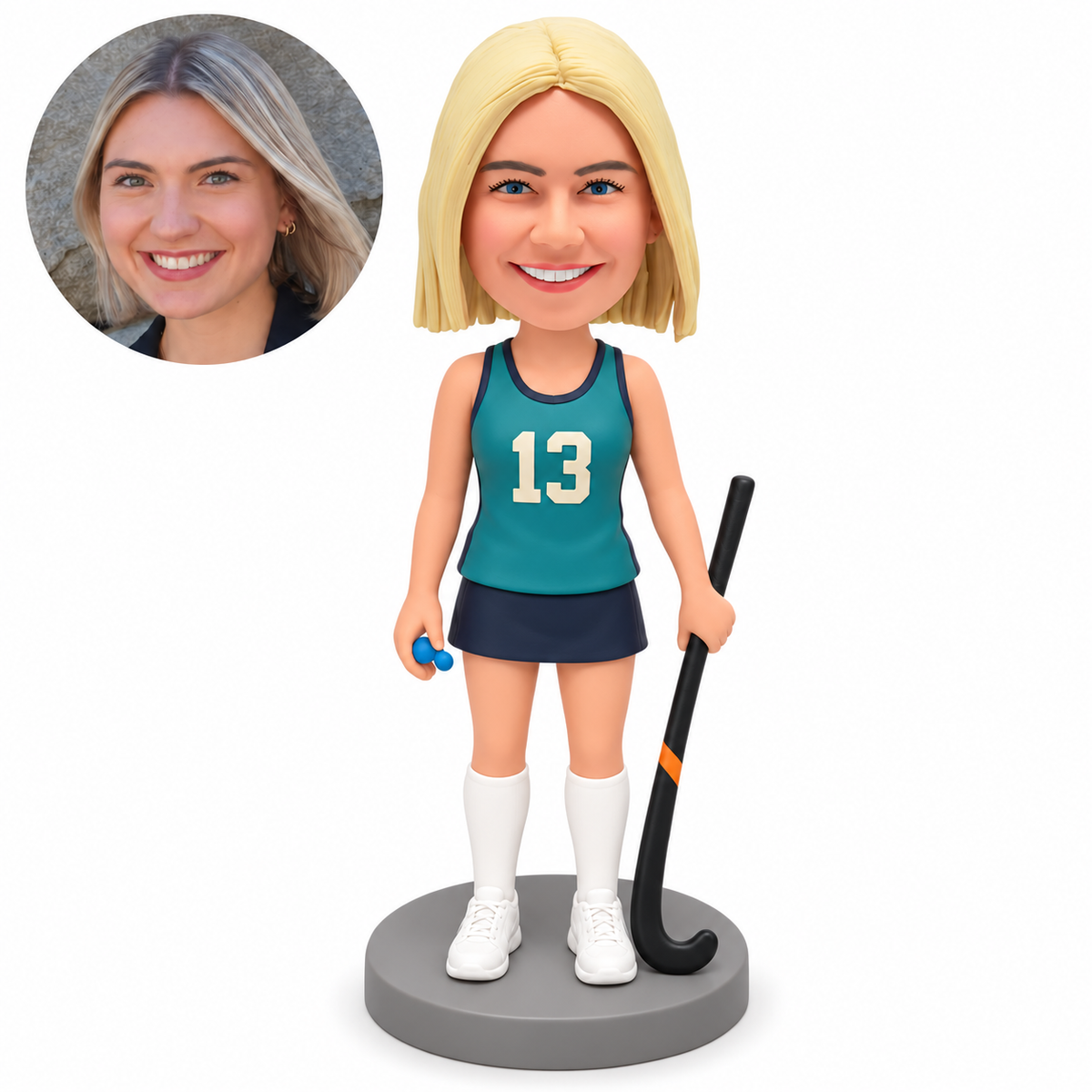custom bobblehead figure female field hockey player holding a grounded stick at her left side
