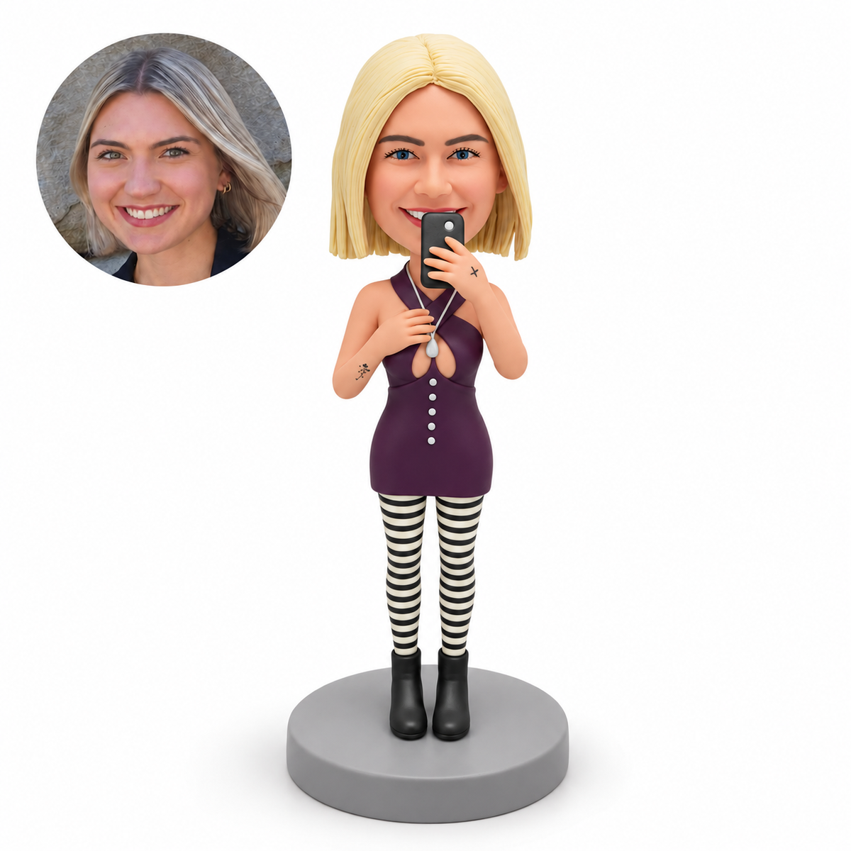 custom bobblehead figure woman holding a phone near her mouth with her left hand and touching her necklace with her right