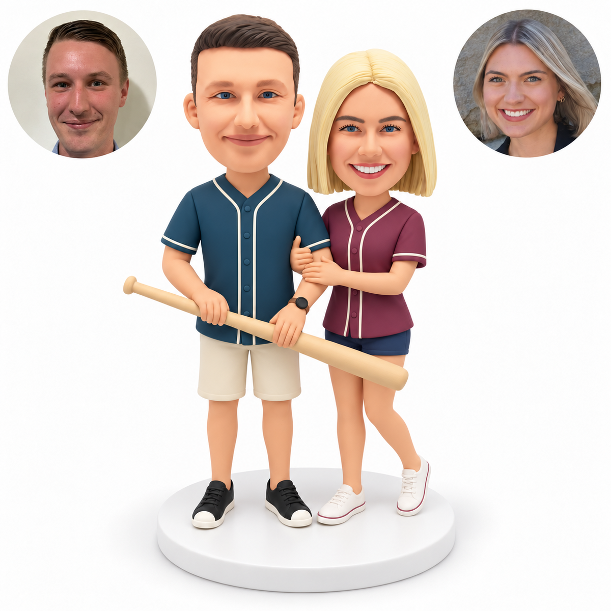 custom bobblehead figures baseball couple with the man holding a lowered bat in both hands and the woman clasping his left arm