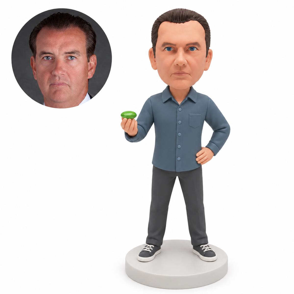 custom bobblehead figure man holding a green gemstone with his other hand on his hip