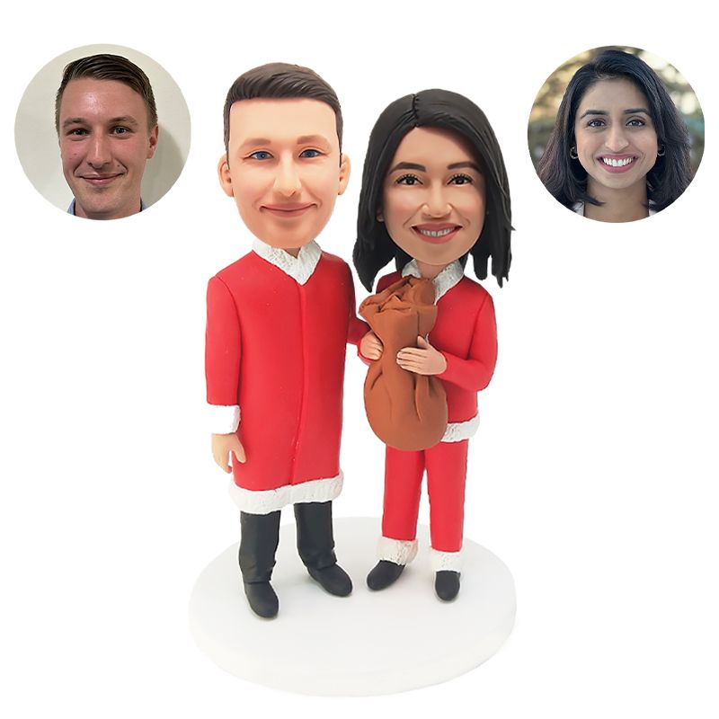 personalised bobble heads figures Christmas Santa couple holding a brown bag
