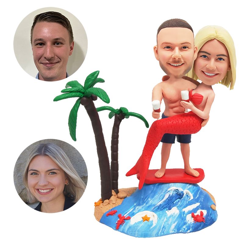 customized bobbleheads figures surfing couple man is holding a mermaid