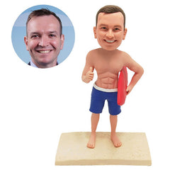 customised surfer bobble head figure man holding a surfboard with one thumb up