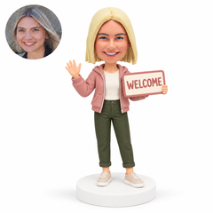 custom bobblehead figure woman waving while holding a welcome sign