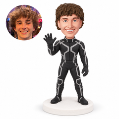 custom bobblehead figure man in a black patterned suit with an open hand