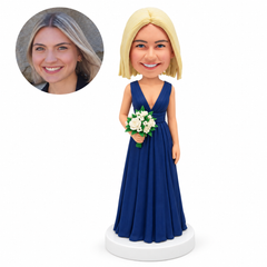 custom bobblehead figure bridesmaid in a navy V-neck gown holding flowers