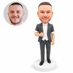 custom bobblehead figure groomsman in a gray short sleeve jacket adjusting a lapel