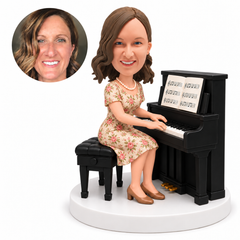 custom bobblehead figure woman in a floral dress playing an upright piano