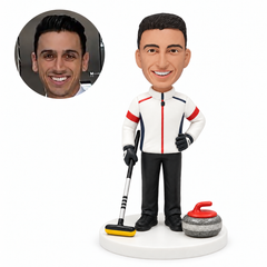 custom bobblehead figure male curling player standing with a broom beside a stone