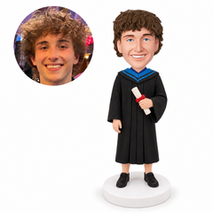 custom bobblehead figure male graduate holding a diploma with one arm at his side