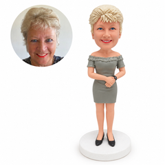 custom bobblehead figure woman in an off-shoulder dress with arms across her waist